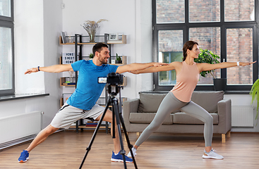 Image showing couple recording home yoga class video