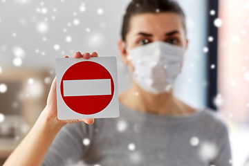 Image showing woman in protective medical mask showing stop sign