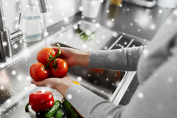 Image showing close up of woman washing vegetables in kitchen