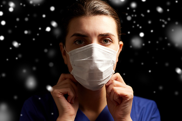 Image showing female doctor or nurse in medical face mask