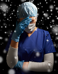 Image showing sad doctor or nurse in goggles and face mask