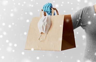 Image showing woman with shopping bag, face mask and gloves