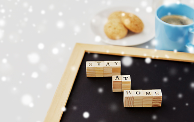 Image showing chalkboard with stay at home words on toy blocks