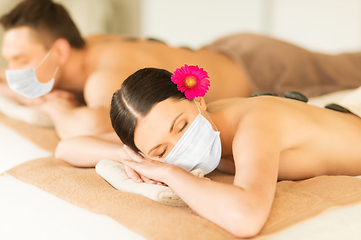 Image showing couple in masks at spa