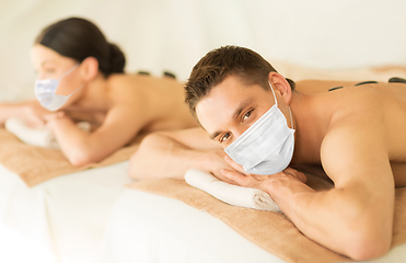 Image showing couple in masks at spa