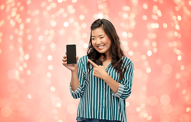 Image showing happy asian woman over grey background