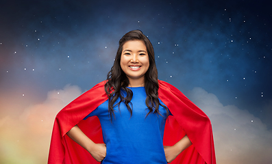 Image showing happy asian woman in red superhero cape at night