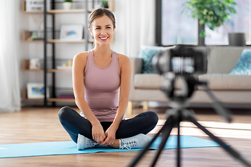 Image showing woman or sports blogger streaming online at home