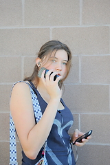 Image showing Female listening to music.