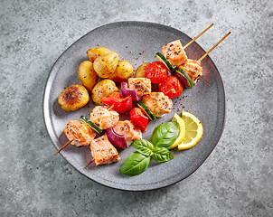 Image showing grilled salmon skewers and vegetables