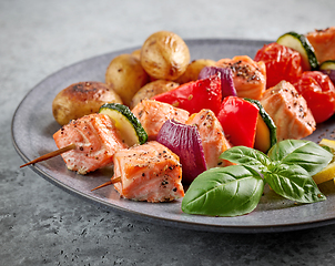 Image showing grilled salmon skewers and vegetables