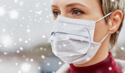 Image showing young woman wearing protective medical mask