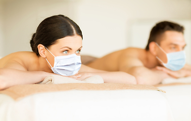 Image showing couple in masks at spa