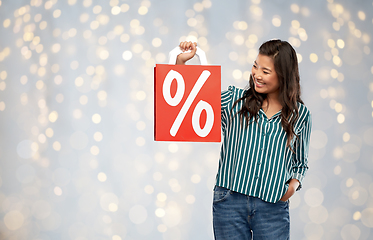 Image showing asian woman with percentage sign on shopping bags