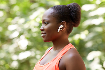 Image showing happy african american woman with earphones