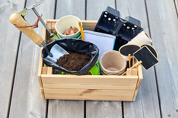 Image showing garden tools, soil and pots in wooden box