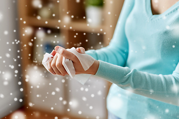 Image showing woman cleaning hands with antiseptic wet wipe