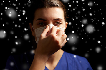 Image showing female doctor or nurse in medical face mask