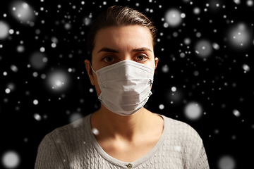 Image showing sick young woman in protective medical face mask