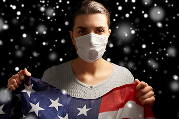 Image showing sick woman in face mask holding flag of america