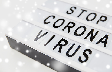 Image showing close up of lightbox with stop corona virus words