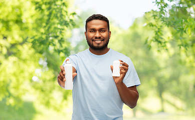 Image showing african american man with antiperspirant deodorant