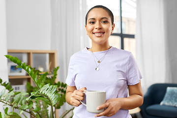 Image showing african american woman drinking coffee at home