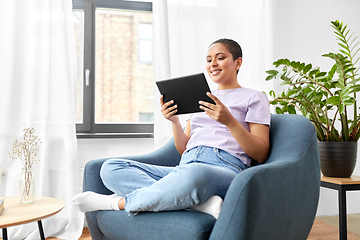 Image showing african american woman with tablet pc at home