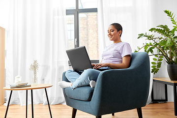 Image showing african american woman with laptop at home