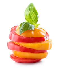 Image showing stack of red and yellow tomato slices