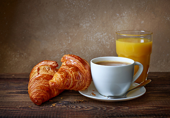 Image showing cup of coffee, croissants and orange juice