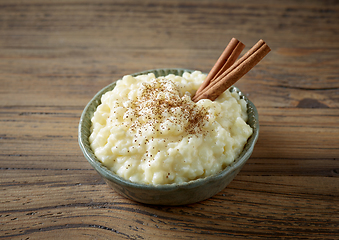 Image showing bowl of rice milk pudding with cinnamon