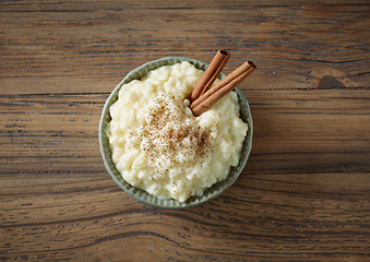 Image showing bowl of rice milk pudding with cinnamon