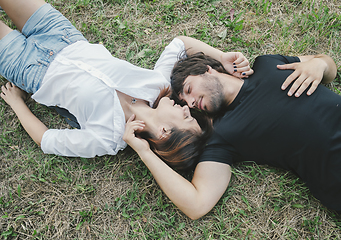 Image showing Couple lying in the grass