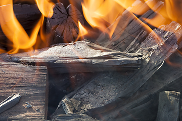 Image showing blackened logs