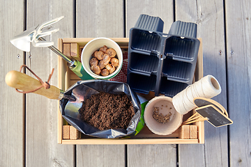 Image showing garden tools, soil and pots in wooden box