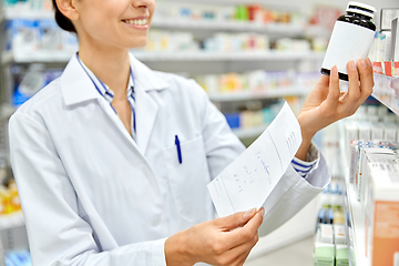 Image showing close up of pharmacist with medicine at pharmacy