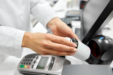 Image showing close up of pharmacist with medicine at pharmacy