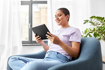 Image showing african american woman with tablet pc at home