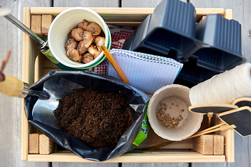 Image showing garden tools, soil and pots in wooden box