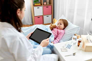 Image showing doctor with tablet pc and sick girl in bed at home