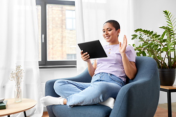 Image showing african woman having video call on tablet pc