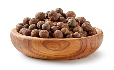 Image showing aromatic black pepper in olive wood bowl