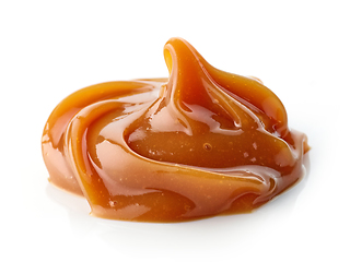 Image showing melted caramel on white background