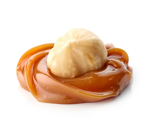 Image showing hazelnut in melted caramel