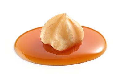 Image showing hazelnut in melted caramel sauce 