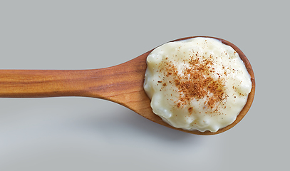 Image showing rice and milk pudding in wooden spoon