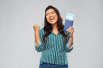 Image showing happy asian woman with air ticket and passport