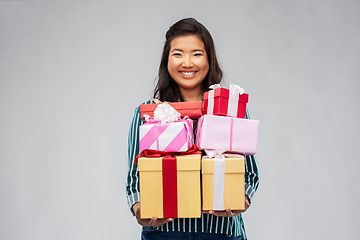 Image showing happy asian woman with birthday presents