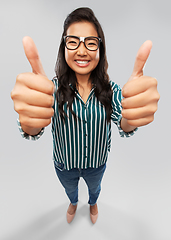 Image showing happy asian student woman showing thumbs up